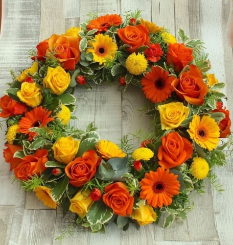 Funeral Flowers Orange Wreath From £45